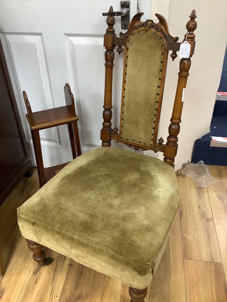 A Victorian nursing chair and an Edwardian book table